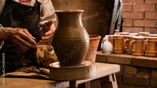 Принти на полотні Potter hands making in clay on pottery wheel