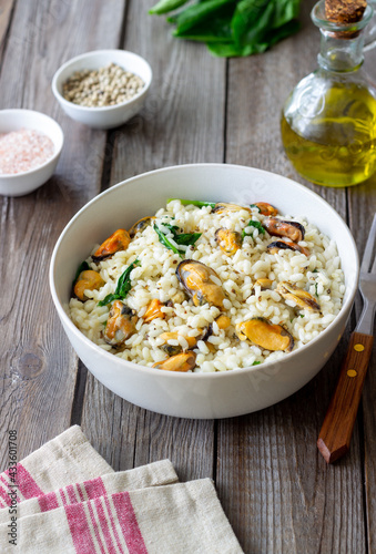 Risotto with mussels and spinach. Healthy food. Vegetarian food.