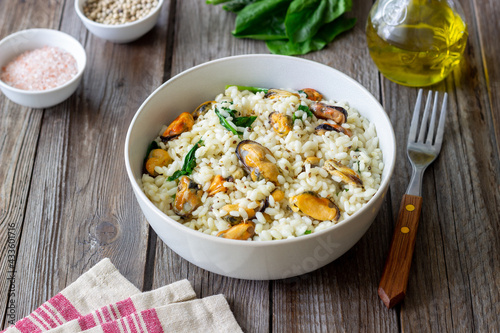 Risotto with mussels and spinach. Healthy food. Vegetarian food.