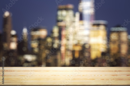 Blank tabletop made of wooden planks with beautiful blurry cityscape at twilight on background  mockup