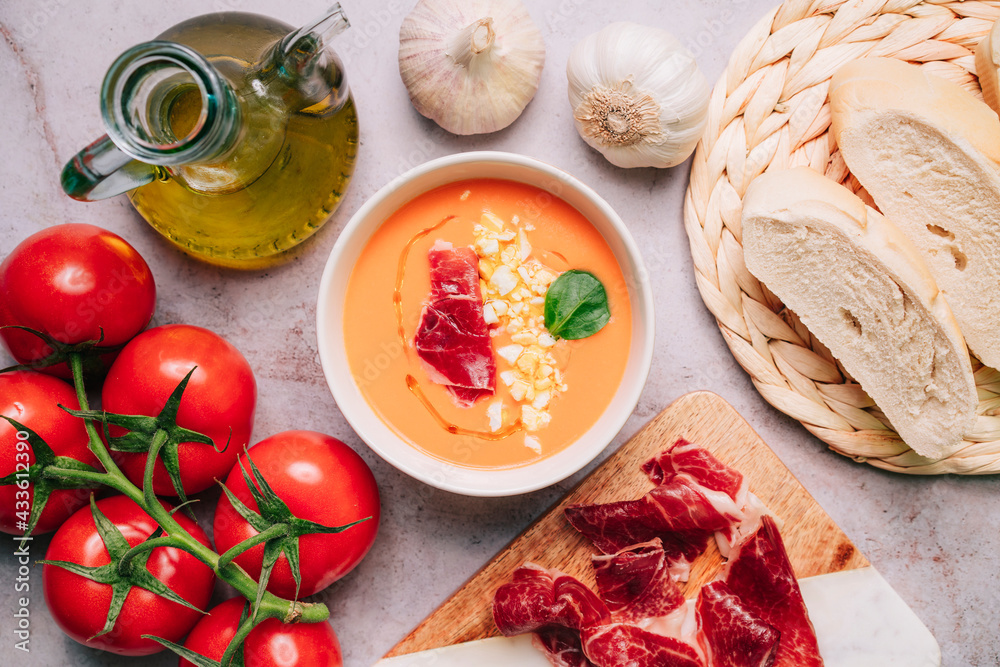 Salmorejo, gazpacho tomato soup in a bowl with ham, olive oil and egg. Top view or flat lay. Close up view Salmorejo, gazpacho tomato soup in a bowl with ham, olive oil and egg. Top view or flat lay. Close up view