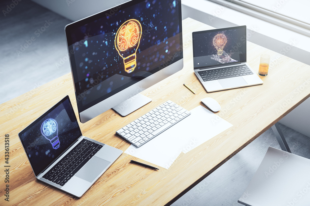 Creative light bulb with human brain hologram on modern laptop monitor, artificial Intelligence and neural networks concept. 3D Rendering Creative light bulb with human brain hologram on modern laptop monitor, artificial Intelligence and neural networks concept. 3D Rendering