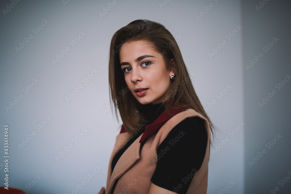 Calm woman with long hair in light room Calm woman with long hair in light room