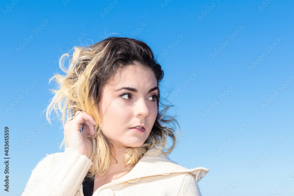 portrait of young woman in a wool sweater outdoors portrait of young woman in a wool sweater outdoors