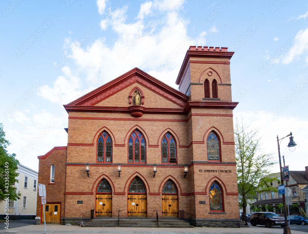 Obraz premium Kingston, NY - USA- May 12, 2021: VIew of the Saint Joseph Roman Catholic Church in the Kingston Stockade District.