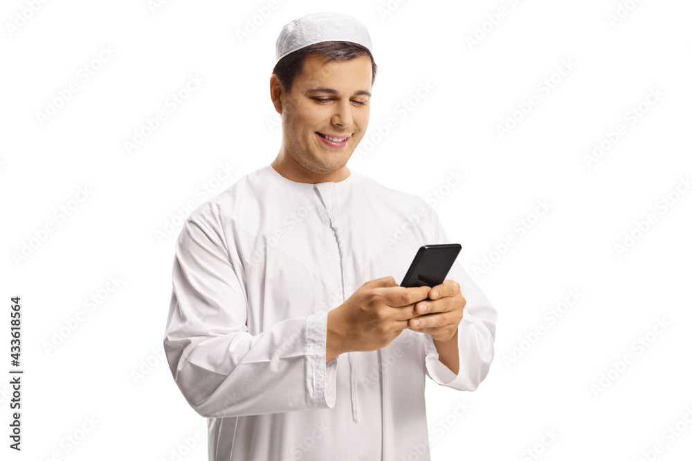 Young muslim man typing on a mobile phone Young muslim man typing on a mobile phone