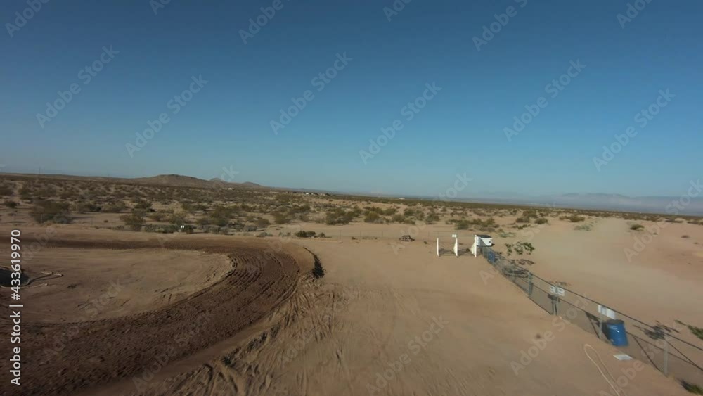 Flying over a off-road racetrack for motorcycles with a first person view of the course Flying over a off-road racetrack for motorcycles with a first person view of the course