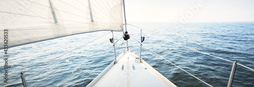 Fotografie, Obraz White yacht sailing on a sunny summer day