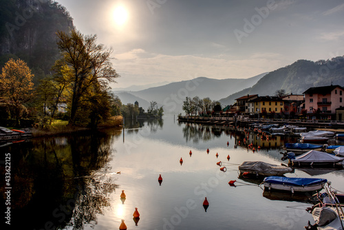 Lugano lake at the narrow point at Lavena Ponte Tresa in the morning at sunrise in spring , hdr images photo