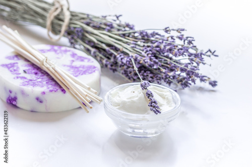 natural herb cosmetic with lavender flowers flatlay on white background