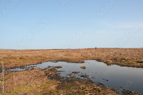 Fotografie high pennine moorland on midgley moor in calderdale with a small pond reflecting