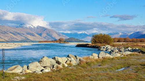 Panoramic view of the Dart River in the South Island of New Zealand, with the Southern Alps in the background