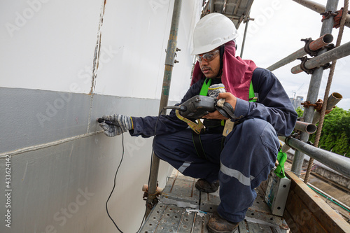 Male worker scaffolding are for inspection ultrasonic thickness shell plate of storage tank