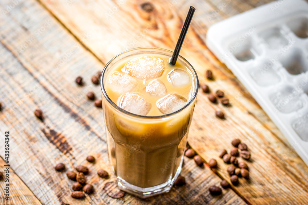 iced coffee with beans for cold summer drink on wooden background - obrazy, fototapety, plakaty 
