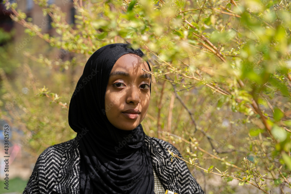 Portrait of a Black Muslim woman with shadows on her face Portrait of a Black Muslim woman with shadows on her face