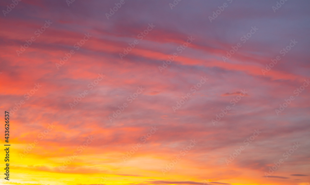 Colorful sunset with clouds in the sky.