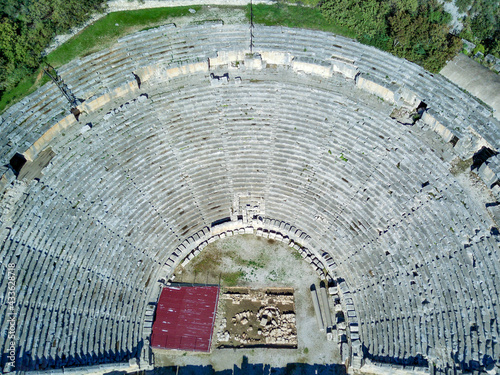 High angle drone aerial view of ancient greek rock cut lykian empire amphitheatre and tombs in Myra (Demre, Turkey) photo