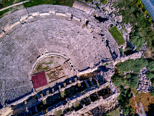 High angle drone aerial view of ancient greek rock cut lykian empire amphitheatre and tombs in Myra (Demre, Turkey) photo