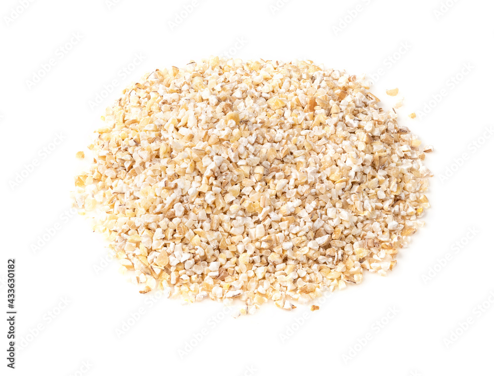 handful of crushed pot barley groats on white handful of crushed pot barley groats on white