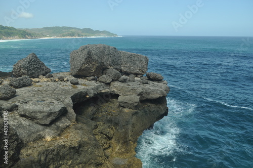 Beautiful scenery on Kedung Tumpang beach with large rocks, Pucanglaban District, Tulungagung Regency, East Java photo