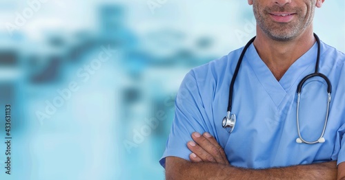 Composition of midsection of male surgeon in scrubs and stethoscope with copy space
