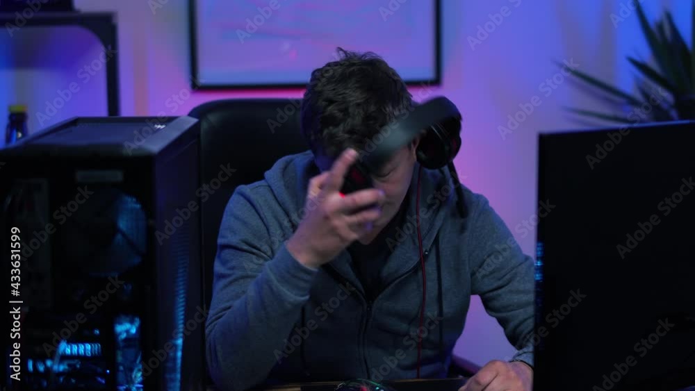 gamer guy actively playing arcade game on desktop computer wins loses. High quality 4k footage