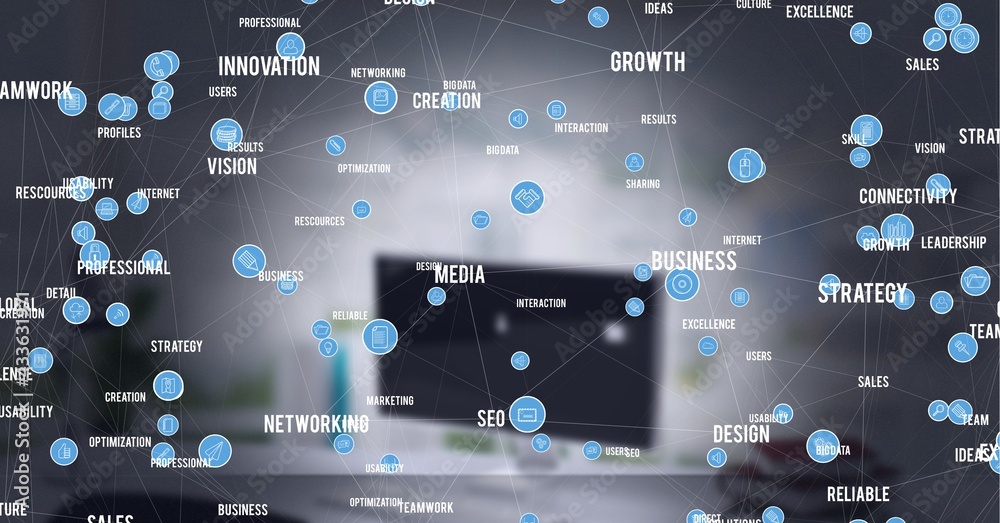 Composition of network of digital icons and text over computer in background
