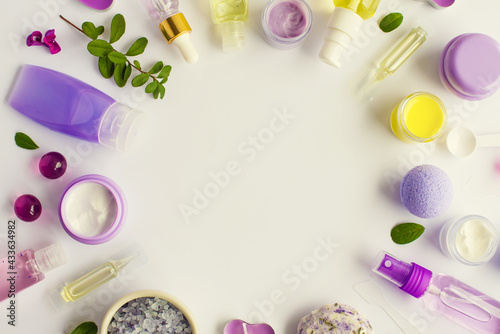 Composition with organic natural cosmetic products on white background. Top view, flat lay. Beauty, skin, hair or body care concept. Self-care beauty and relaxation routine. Lavender and yellow colors