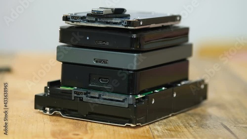 Pile of hdd memory storage devices over dark surface,tech components,usb,memory