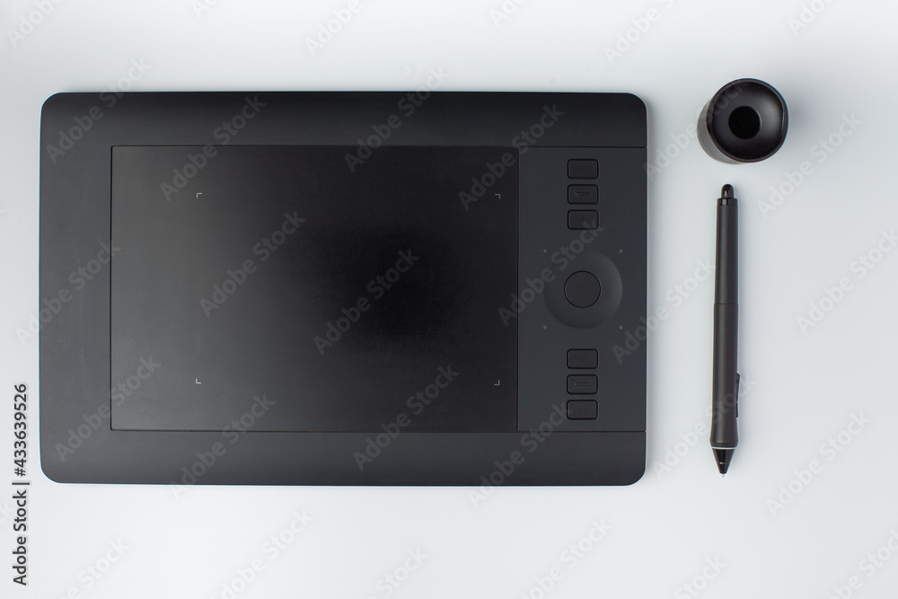 Top view photo of a graphic design tablet on a white background. Top view photo of a graphic design tablet on a white background.