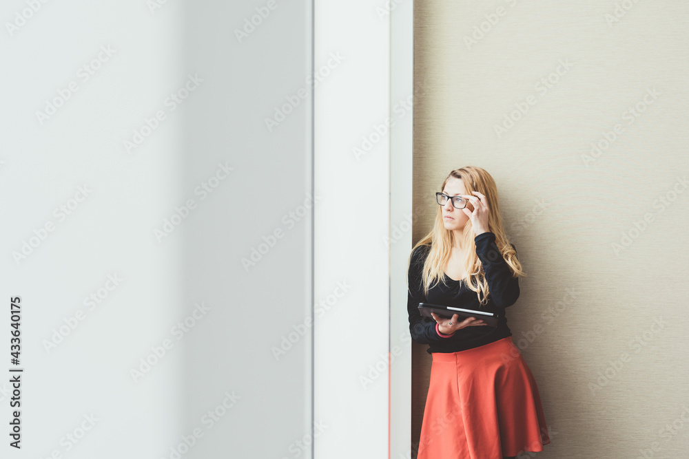 young successful businesswoman indoors office holding tablet young successful businesswoman indoors office holding tablet