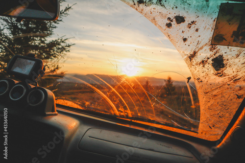 Offroad car trip through the Ukrainian Carpathians in spring. View from the window. External expedition. Sunset car view photo