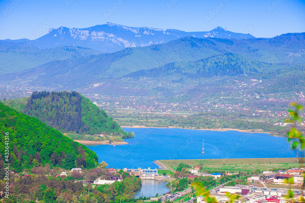 Lake and Ceahlau mountain seen from Piatra Neamt city, Romania