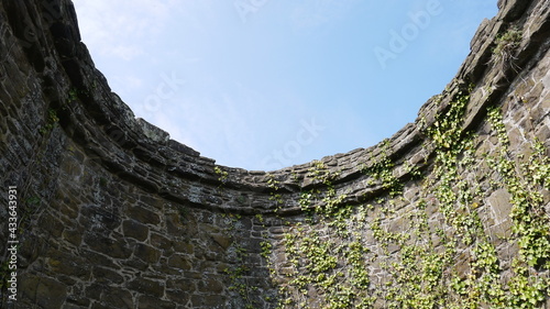 Blue sky above a stone castle turret