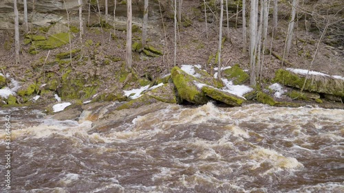 The rushing water on the river in Nommeveski Estonia as a part of the Lahemaa National Park photo