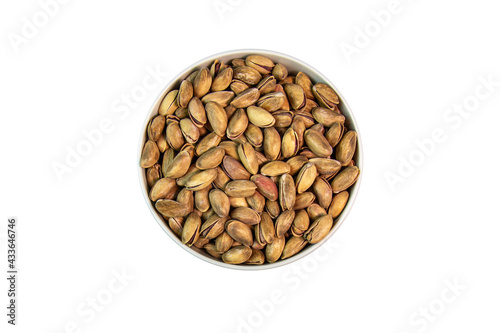 pistachios in bowl on white background close up