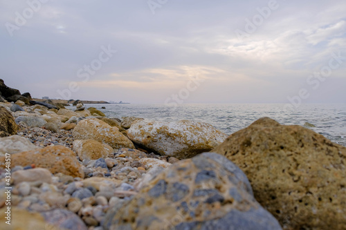 Magical sunset background natural colours crashing wave Cyprus landscape beach sea stone . High quality photo
