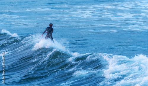 Photography Man surfing the waves of the california coast