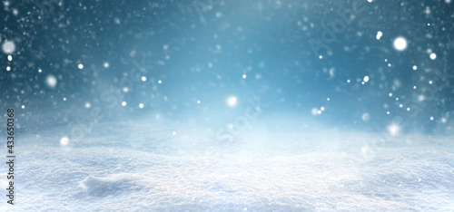 Fotografie Christmas snow background with snow drifts in snowfall