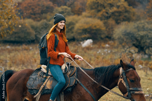 woman tourist riding horse mountains landscape lifestyle