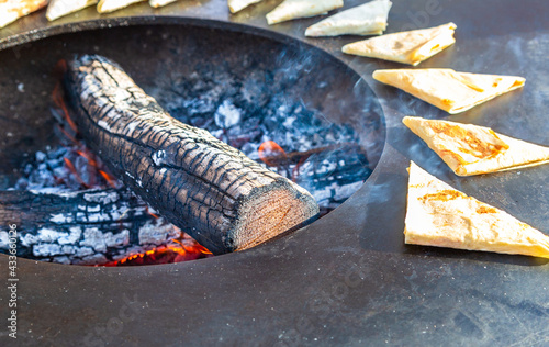 Appetizing traditional uzbek pies cooking outdoors photo