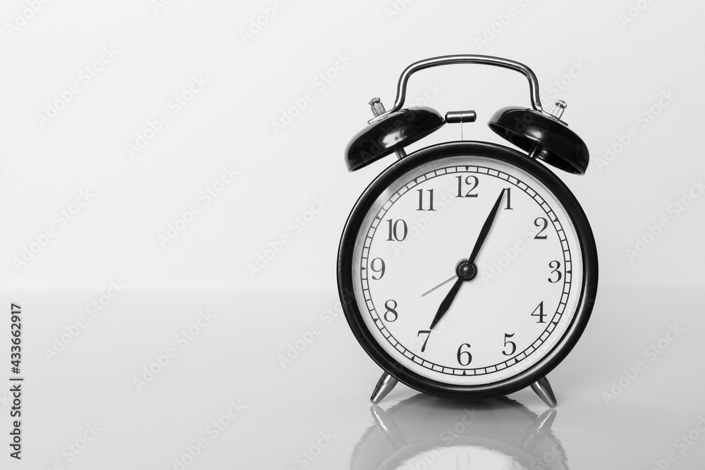 Classic black alarm clock on white background. Time concept. Classic black alarm clock on white background. Time concept.