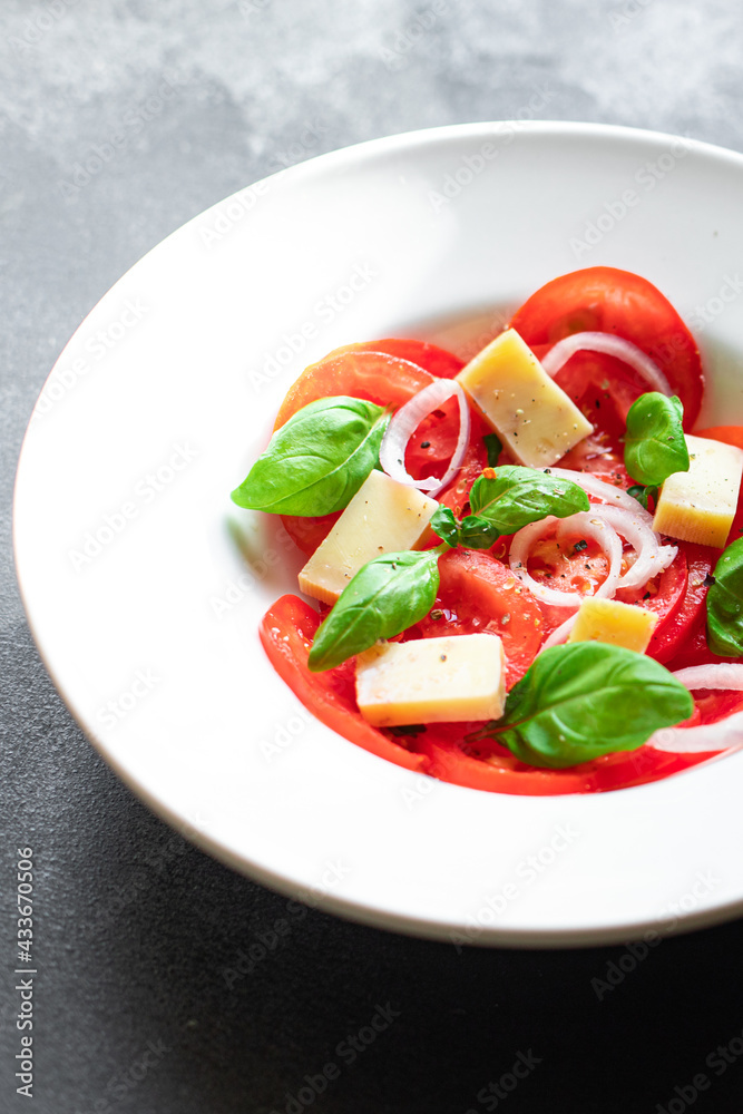 tomato salad vegetables cheese onions diet vitamins on the table healthy food meal snack copy space food background rustic. top view keto or paleo diet veggie vegan or vegetarian food tomato salad vegetables cheese onions diet vitamins on the table healthy food meal snack copy space food background rustic. top view keto or paleo diet veggie vegan or vegetarian food