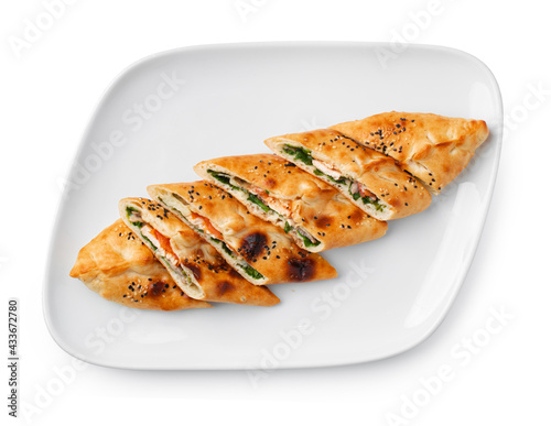 Turkish boat-shaped flatbread pide isolated on white