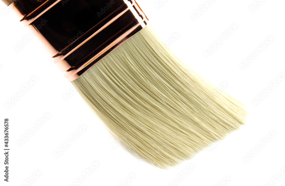 Fototapeta premium A new beautiful painting brush on a white background.