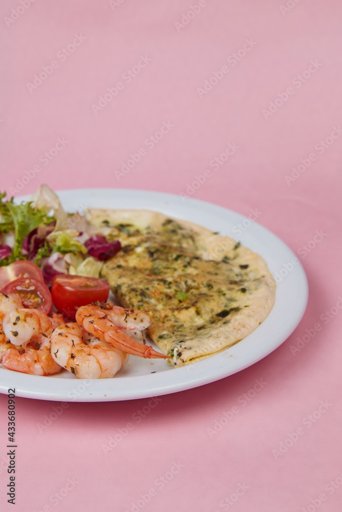 salad and omelet in a plate, tomatoes, cucumbers, greens and cabbage, diet food and drink for breakfast and lunch salad and omelet in a plate, tomatoes, cucumbers, greens and cabbage, diet food and drink for breakfast and lunch