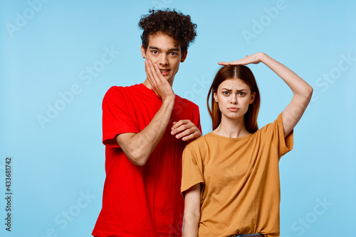 man and woman standing side by side communication fashion modern style blue background