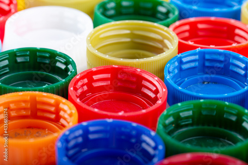 Plastic bottle caps background. Cap material is recyclable.