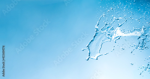 Water splashes with copy space  blue background
