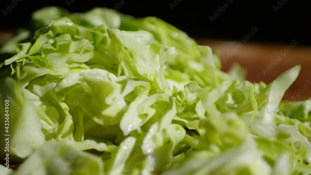 Close up cabbage slices falling down. 4k video. Vegan salad ingredient Close up cabbage slices falling down. 4k video. Vegan salad ingredient